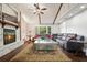 Bright living room features a stone fireplace, large sectional sofa and vaulted ceilings at 2801 Holly Oaks Dr, Marietta, GA 30062