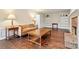 Bright living room featuring hardwood floors, a fireplace and built-in shelves at 2801 Holly Oaks Dr, Marietta, GA 30062