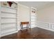Light filled living room featuring hardwood floors and custom built-in bookshelves at 2801 Holly Oaks Dr, Marietta, GA 30062