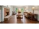 Inviting living room with hardwood floors, a cozy fireplace, and plenty of natural light at 2801 Holly Oaks Dr, Marietta, GA 30062