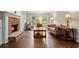 Cozy living room featuring hardwood floors, a traditional fireplace, and ample natural light at 2801 Holly Oaks Dr, Marietta, GA 30062
