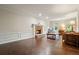 Comfortable living room featuring fireplace, wainscoting, and hardwood flooring at 2801 Holly Oaks Dr, Marietta, GA 30062