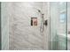 Modern shower features marble-style tile, a rainfall showerhead, and built-in shelving at 2801 Holly Oaks Dr, Marietta, GA 30062