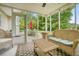 Enclosed sunroom with wicker furniture, offering a relaxing space with views of the outdoors at 2801 Holly Oaks Dr, Marietta, GA 30062