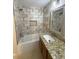 Stylish bathroom with tiled walls and granite countertop at 310 Bloomfield Ct, Roswell, GA 30075