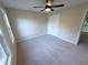 Cozy bedroom with a ceiling fan and a double-door closet at 310 Bloomfield Ct, Roswell, GA 30075