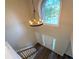 Bright foyer with a view from above, featuring a decorative light fixture and a large window at 310 Bloomfield Ct, Roswell, GA 30075