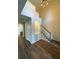 Elegant foyer featuring high ceilings, hardwood floors, and a staircase with white trim and carpet at 310 Bloomfield Ct, Roswell, GA 30075