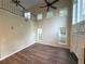 Spacious living room with vaulted ceilings, dark wood floors, fireplace, and plenty of natural light at 310 Bloomfield Ct, Roswell, GA 30075
