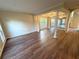 Bright living room with hardwood floors, classic columns, and a decorative chandelier, with great flow to other spaces at 310 Bloomfield Ct, Roswell, GA 30075