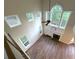 Open-concept living room with hardwood floors, fireplace, and large windows at 310 Bloomfield Ct, Roswell, GA 30075