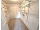 Functional walk-in closet with built-in shelving at 310 Bloomfield Ct, Roswell, GA 30075