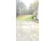 Home's spacious outdoor area featuring patio, grill, and storage shed at 4064 Sunset Dr, Atlanta, GA 30331