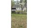 Backyard view showcasing a home with a screened porch and partially fenced yard at 4064 Sunset Dr, Atlanta, GA 30331