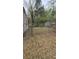 View of a spacious, fenced backyard featuring shed and chain link at 4064 Sunset Dr, Atlanta, GA 30331