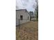 View of backyard featuring chain link fence, storage shed, and grassy area at 4064 Sunset Dr, Atlanta, GA 30331