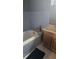 Small bathroom featuring a blue tiled walls and updated vanity at 4064 Sunset Dr, Atlanta, GA 30331