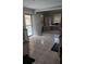 Spacious kitchen with tile flooring, ample cabinet space, and an adjacent outdoor patio at 4064 Sunset Dr, Atlanta, GA 30331