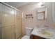 Cozy bathroom offering a shower and vanity with floral accents at 110 Otelia Ln, Covington, GA 30014