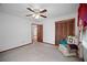 Bedroom with ceiling fan, chair and closet at 110 Otelia Ln, Covington, GA 30014
