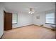 Spacious bedroom with hardwood floors, neutral walls, and natural light at 110 Otelia Ln, Covington, GA 30014