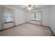 Comfortable bedroom with neutral carpeting and classic window coverings at 110 Otelia Ln, Covington, GA 30014