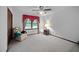 Bright bedroom with cozy chair, soft carpet, and ample natural light at 110 Otelia Ln, Covington, GA 30014