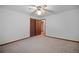 Airy bedroom featuring neutral walls, broadloom carpet, and convenient closet at 110 Otelia Ln, Covington, GA 30014