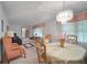 Elegant dining room with chandelier, pink accents, and ornate details at 110 Otelia Ln, Covington, GA 30014