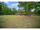 A charming brick home featuring a spacious front lawn and mature shade trees at 110 Otelia Ln, Covington, GA 30014