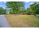 Attractive home featuring a large front yard and well-maintained landscaping at 110 Otelia Ln, Covington, GA 30014