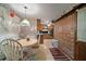 Dining nook featuring wood cabinets and brick accent wall at 110 Otelia Ln, Covington, GA 30014