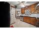 Bright kitchen with retro features, wooden cabinets, and adjacent dining area at 110 Otelia Ln, Covington, GA 30014