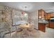 Cozy kitchen nook featuring a round table and floral wallpaper at 110 Otelia Ln, Covington, GA 30014