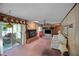 Cozy living room with a brick fireplace and wood paneling at 110 Otelia Ln, Covington, GA 30014