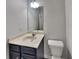 Clean bathroom features a vanity with a sink and a toilet for convenient use at 245 Brickstone Pkwy, Covington, GA 30016