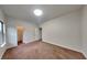 Bright bedroom featuring plush carpet, neutral walls, and a large window at 245 Brickstone Pkwy, Covington, GA 30016
