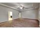 Spacious main bedroom featuring tray ceilings and a ceiling fan, offering a relaxing retreat at 245 Brickstone Pkwy, Covington, GA 30016