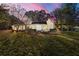 Back view of this lovely home with level yard and outdoor patio area at 2490 Turtle Ter, Grayson, GA 30017
