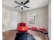 Charming bedroom featuring a ceiling fan and a playful, vibrant fire truck-themed decor, perfect for children at 2490 Turtle Ter, Grayson, GA 30017