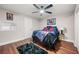 Cozy bedroom with hardwood floors, ceiling fan, and comic decor at 2490 Turtle Ter, Grayson, GA 30017