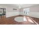 Open dining room featuring hardwood floors, chandelier, and natural light at 2490 Turtle Ter, Grayson, GA 30017