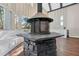 A stone fireplace in a spacious living room has built in benches and lots of natural light at 2490 Turtle Ter, Grayson, GA 30017
