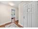 A bright hallway features hard wood floors and white trim that provide a modern and clean aesthetic at 2490 Turtle Ter, Grayson, GA 30017