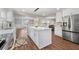 Modern kitchen with a large island, stainless steel appliances, and white cabinetry at 2490 Turtle Ter, Grayson, GA 30017