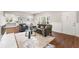 Open-concept living room with fireplace, stylish furniture, and hardwood floors at 2490 Turtle Ter, Grayson, GA 30017