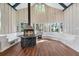 A living room features a stone fireplace, hardwood floors, lots of windows, and built in benches at 2490 Turtle Ter, Grayson, GA 30017