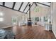 A living room features a stone fireplace, hardwood floors, lots of windows, and built in benches at 2490 Turtle Ter, Grayson, GA 30017