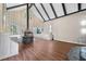 A living room features a stone fireplace, hardwood floors, lots of windows, and built in benches at 2490 Turtle Ter, Grayson, GA 30017
