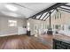 An open living room features hardwood floors, natural light, a statement fireplace, and white cabinets at 2490 Turtle Ter, Grayson, GA 30017